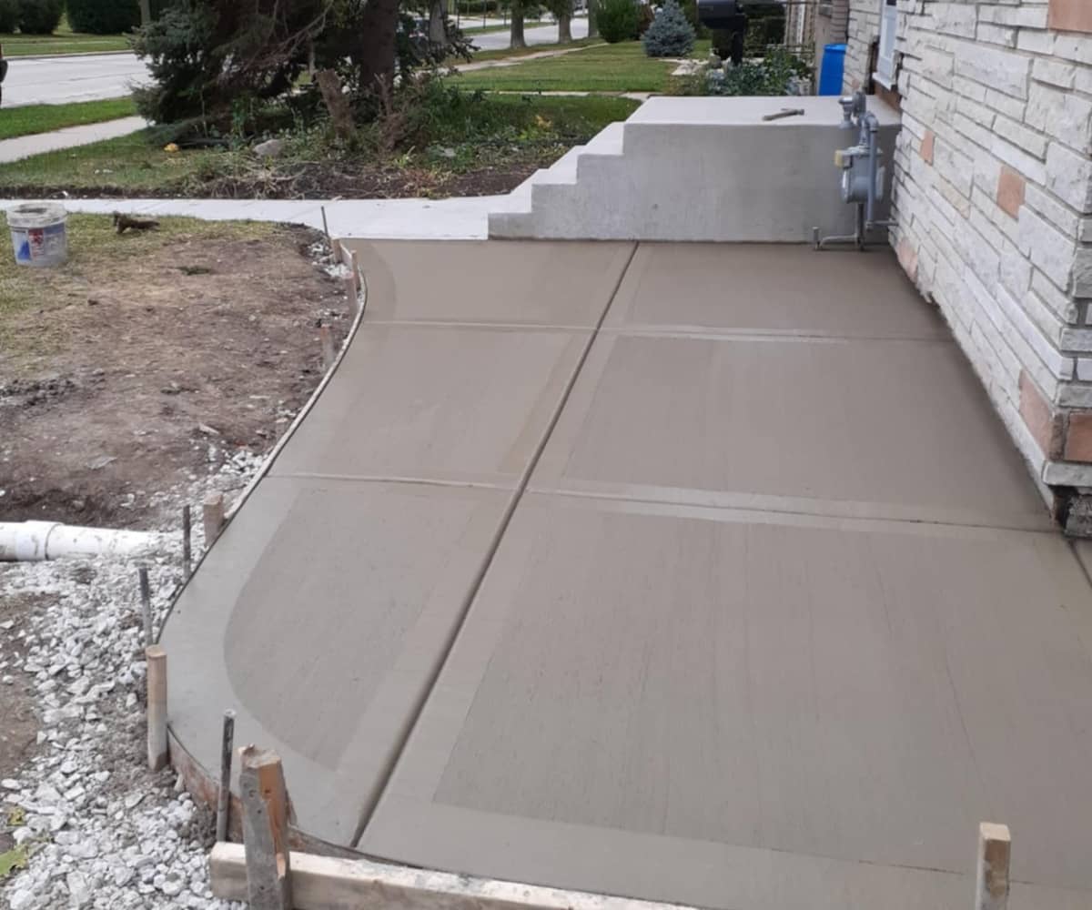 home concrete sidewalk with new concrete stairs