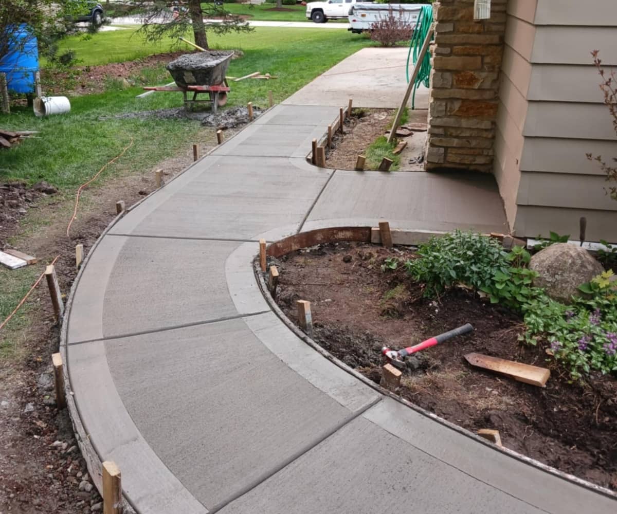 residential concrete sidewalk leading to front of home